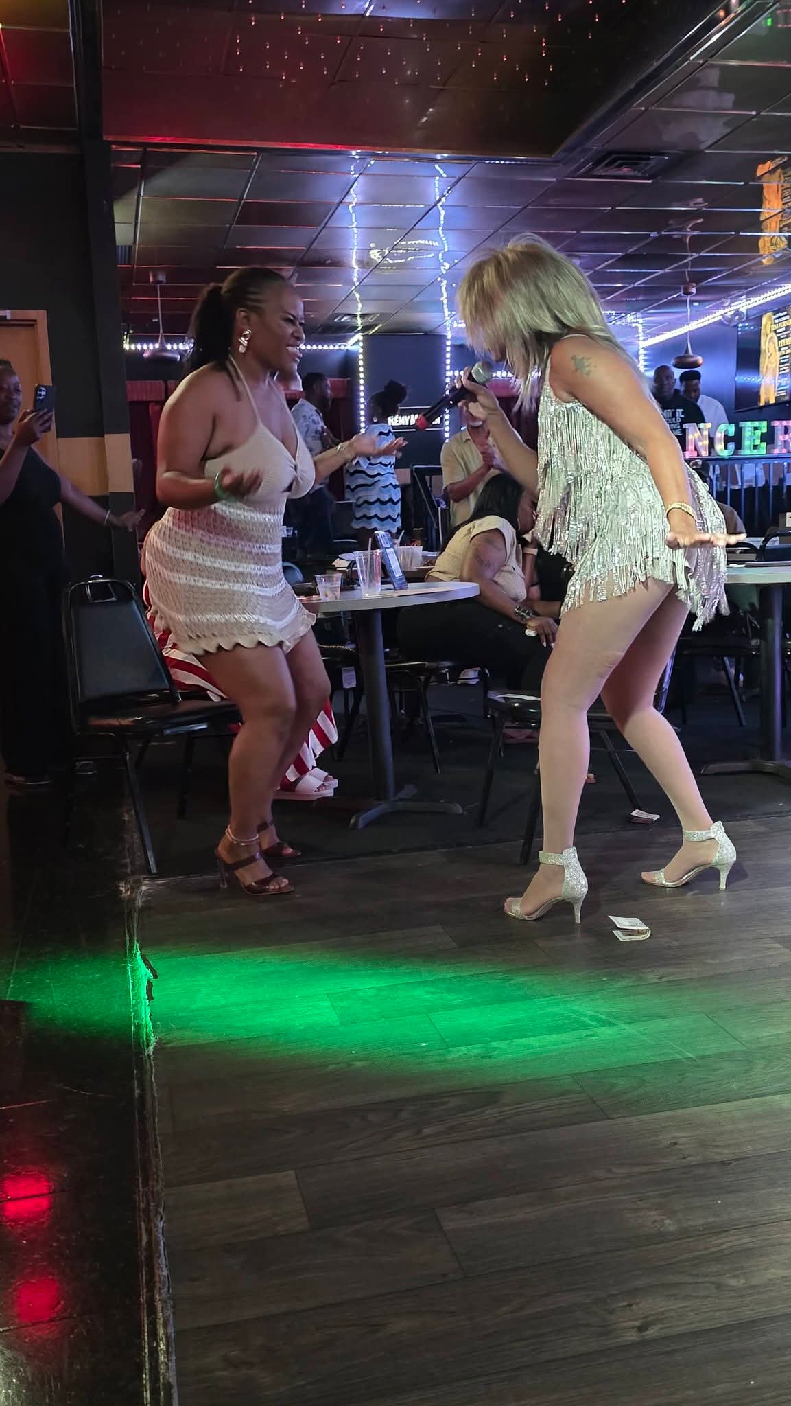 1 Tyme singing alongside a smiling audience member